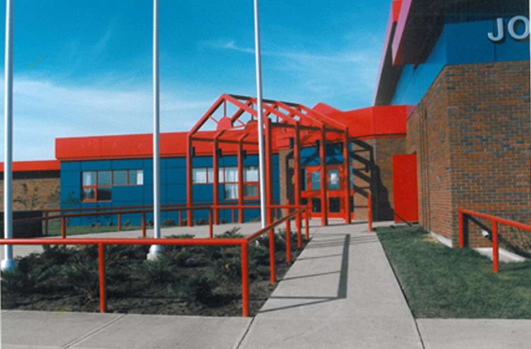 Archive photograph of John D'Or Prairie School: the red steel entrance canopy against blue panels and brick