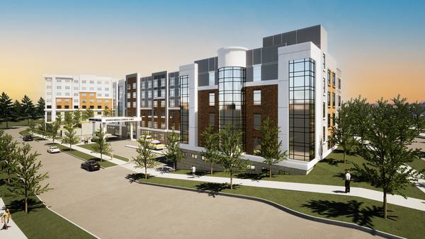 Closer street-corner view of Advanced Medical and The Academy of Aging at Currie, with glazed stair towers and brick bays (architectural rendering)