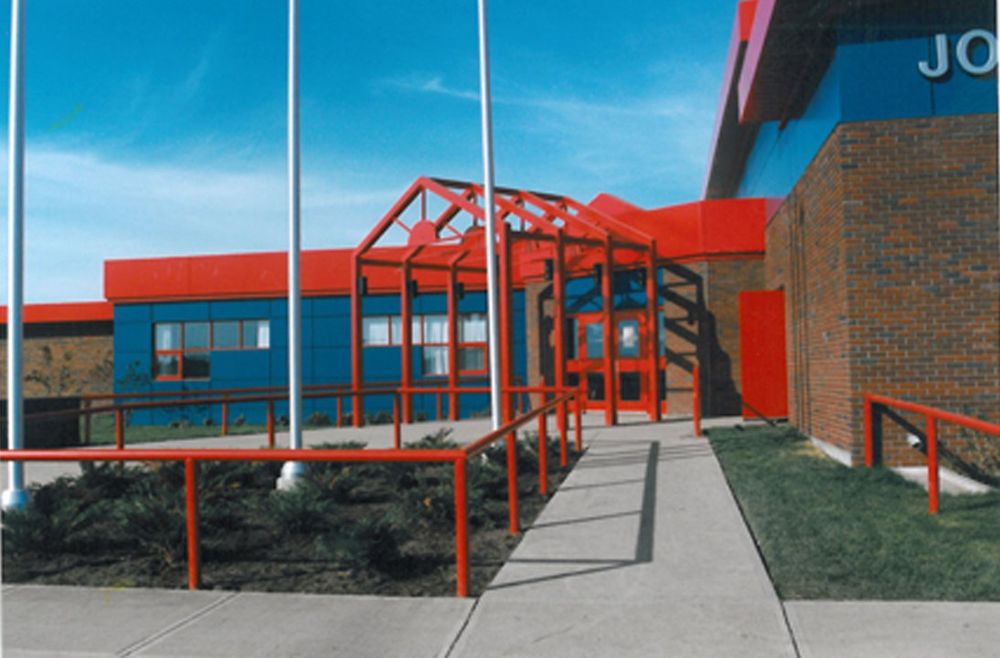 Archive photograph of John D'Or Prairie School: the red steel entrance canopy against blue panels and brick